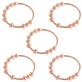 Detailansicht von fünf rotgoldenen Anti-Angst-Ringen mit drehbaren Perlen auf weißem Grund - Größe 14 (1.8cm ID) / 5er Pack / Roségold