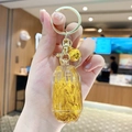 Quicksand dream bear keychain with resin prism pendant featuring gold wheat and bell - Wheat - Gem