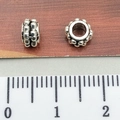 Silver spacers with grain texture for DIY bracelets shown with ruler measurement - Granular Round Spacer Bead