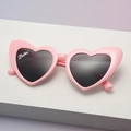 Pink heart-shaped sunglasses with dark grey lenses and Tribe print design - Bride Pink