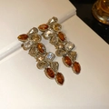 Detailed overhead view of 18k gold plated vintage pearl flower drop earrings with amber stones - Gold Brown Long Dangle Style (20#)