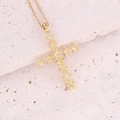 Detailed macro view of 18K gold plated cross pendant with cubic zirconia on stone base - 7# Yellow