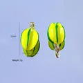 Macro detail of starfruit resin pendants showing precise 1.2cm size and 2g weight - Starfruit