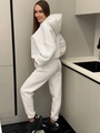 Detail view of white hooded tracksuit set with fleece lining and jogger pants side profile - White