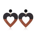 Detail view of heart-shaped drop earrings with two-tone black and wood grain texture - Style 69