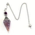 Macro shot of amethyst pendulum necklace with copper spiral wire and silver chain detail - Amethyst
