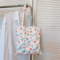 Detailed view of pink peony floral print on a minimalist cotton tote bag with label - Pink Large Flowers