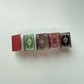 Close-up of five colorful miniature book hair clips with vintage gold cover patterns - 9# Black Coffee Book Clip