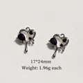 Detailed view of silver heart charms with black stones measuring 17x24mm for DIY jewelry - 8# Hollow Black Zirconia Heart