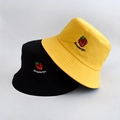 Detail of embroidered strawberry and Strawberries text on cotton reversible bucket hat - Adult 55-58cm / Strawberry Yellow