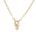 Macro detail of gold-plated paperclip chain with Taurus zodiac pearl pendant - Taurus / Gold