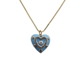 Detailed close-up of golden heart pendant with blue enamel evil eye and sparkling crystals - Blue