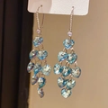 Detail of silver needle earrings featuring cascaded blue heart-shaped crystal tassels - Style 43# Ear Hoop-Silver-Blue