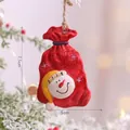 Christmas snowman resin ornament with Let It Snow text and rustic rope hanging on tree - Snowman Gift Bag