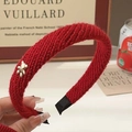 Elegant red knitted headband for women featuring a small golden bear charm detail - Red Knit with Gold Bear