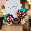 Pair of strawberry hair ties featuring red glitter resin charms on black elastic bands - Flower Red Strawberry