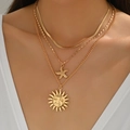 Three-layer gold starfish and sun pendant necklace displayed on a model in white - Gold Starfish Sun