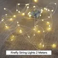 Warm yellow LED firefly string lights 2 meters long with battery box on burlap background - 2m Firefly LED String Lights