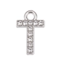 Macro shot of silver letter T pendant with shimmering rhinestones for DIY jewelry - Letter T