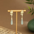 Detail of gold fan earrings with light green teardrop pendants and white rhinestones - Fan Rhinestone Water Drop (E6461)