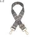 Close-up of black and white geometric patterned bag strap with golden metal clasps - L-2 Black Khaki