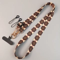 Adjustable crossbody phone lanyard featuring a beige fabric with mandala ethnic patterns - Kazakh Brown