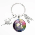 Silver ballet dancer keychain with glass gem pendant and alloy charms on white background - Ballet Hand-drawn Illustration