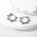 Punk style stainless steel hoop earrings with spiked rivet studs for a hip hop look - Silver