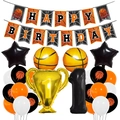 Close-up of basketball party set with Champion trophy balloon and Happy Birthday banner - 1st Birthday Style