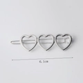 Silver alloy hair clip with three hollow heart shapes and polished finish, 6.1cm length - Three Hearts Silver