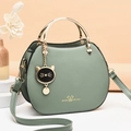 Light green cat shell crossbody bag with golden metal handle and cute cat pendant - Green