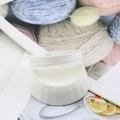 Macro detail of white jewelry weaving cord roll on spool for DIY handmade bracelets - 10m / White