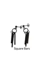 Macro detail of matte black square bar earrings in titanium steel with column pendants - Black Square Bar Stud (Single)