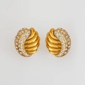 Close-up of vintage gold earrings with emerald green zircon and pave crystals - White