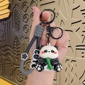 Cute panda keychain with green bamboo and grey 'CUTE' wrist strap for backpack decoration - Electroplated Holding Bamboo