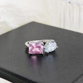 Silver open ring featuring a square pink gem and a pear-shaped clear stone on a black box - Square Stone Pink Ljz-190 / Adjustable Open