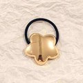 Rose gold flower hollow alloy hair tie with black elastic band on textured paper - Gold Chunky Star 5cm