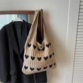 Knitted beige heart pattern tote bag displayed on a hanger for casual everyday styling - Black Heart / Khaki