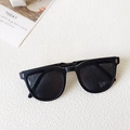 Portable folding kids sunglasses in classic black with stylish silver hinge details - Matte Black