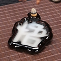 Creative black ceramic backflow incense burner featuring a white Wu character mist effect - Enlightenment