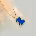 Detailed view of the dark blue resin bear pendant with gold stars on a delicate water wave chain - Royal Blue Lip Chain