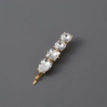 Classic golden snowflake brooch with assorted clear crystals and round pearl accents - Gold White Rhinestone Hair Clip