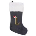 Detail of grey velvet Christmas stocking with gold glitter letter L and white faux fur trim - Letter L