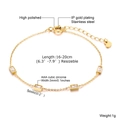 Macro detail of gold stainless steel bracelet with green AAA cubic zirconia and specs - Gold Round Zirconia Adjustable Bracelet (BR-935G)