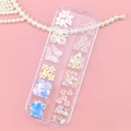 Detailed view of DIY nail art kit with assorted 3D bows, pearls and butterfly charms - Aurora 3D Mixed Accessories Style (T-344)