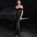 Detail of off-shoulder black evening gown with delicate lace stitching and satin finish - S / Black