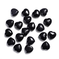 Polished 20mm heart-shaped black sandstone gemstones displayed on white background - Blue Sandstone
