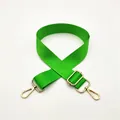 Detail of adjustable vibrant green nylon bag strap with polished gold lobster clasps - Gold Buckle / Fluorescent Green