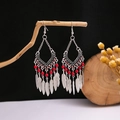 Detail of vintage silver feather earrings with red beads and bohemian ethnic patterns - E1895 Red Feather Ethnic