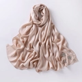 Detailed view of champagne chiffon hijab with sparkling rhinestone floral embellishments - Champagne Pink
